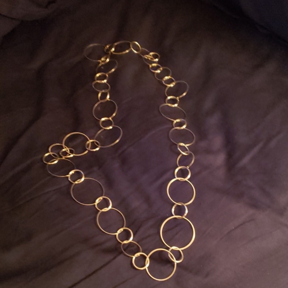 Elegant gold tone necklace worn one , if even